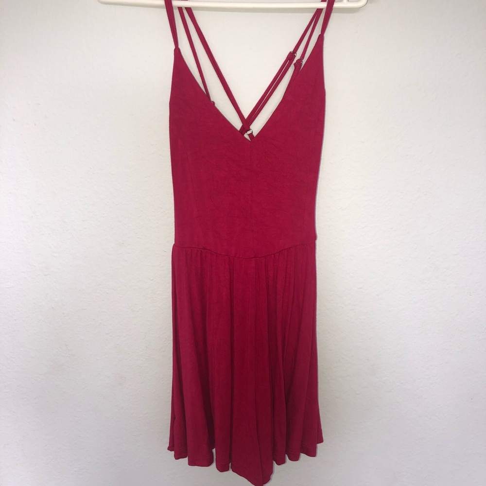 NEVER WORN pink romper with criss cross back